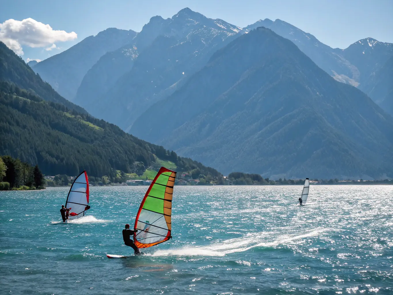 A dynamic image of athletes practicing windfoil sailing on the water, with vibrant sails and a scenic backdrop, showcasing the energy and skill involved in the sport.